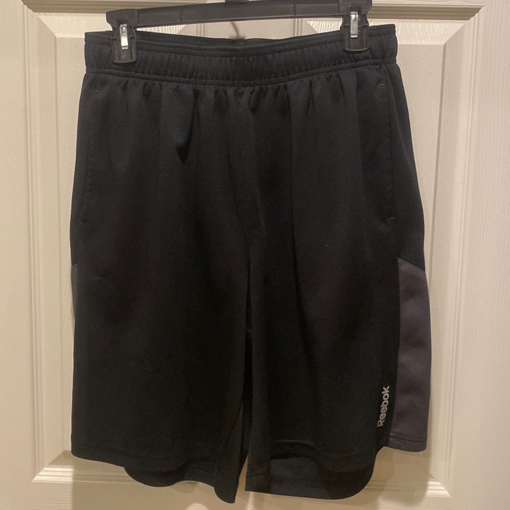 Men’s medium Reebok black with grey basketball shorts.